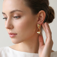 Bow Gold Earrings sleek polished bow stud earrings 31mm length 9mm width gold plated brass and copper