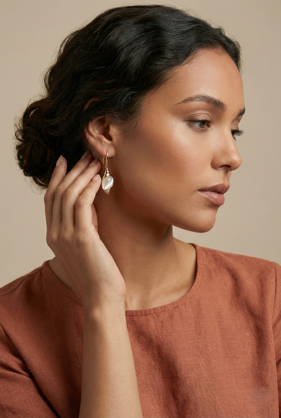 Caracola Gold Hook Earrings with clear cubic zircons and cat eye glass stone in lustrous gold finish