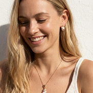 Long Chain Pendant Necklace - Caracola gold necklace with smooth cat eye glass stone pendant on adjustable gold-tone chain