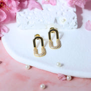 Remitta Zircon Gold Earrings with brass and copper base featuring a 19mm length and sparkling zircon stone