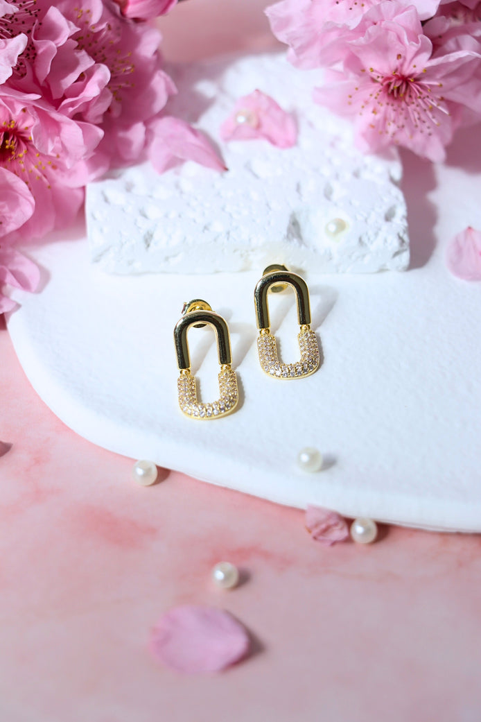 Remitta Zircon Gold Earrings with brass and copper base featuring a 19mm length and sparkling zircon stone