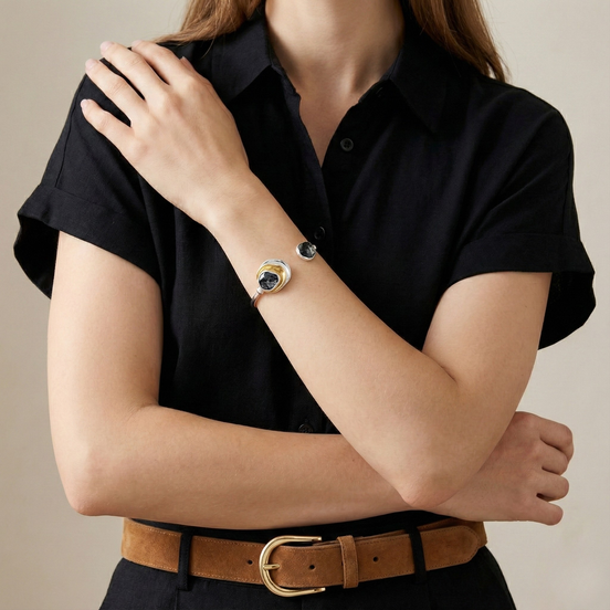 Kirana tri-tone open-style bracelet with dark grey, white, and gold circular accents