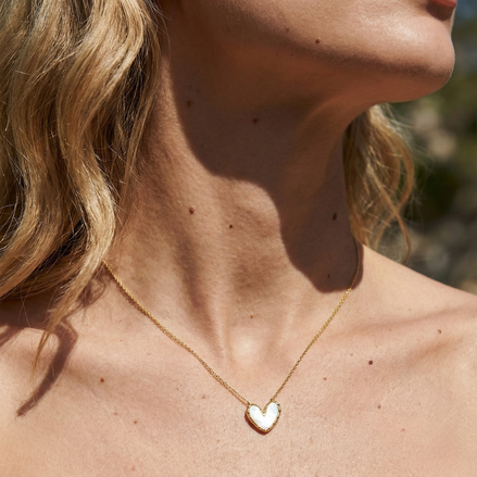 Lovia Mother Of Pearl Gold Necklace with heart-shaped mother of pearl pendant on adjustable gold chain worn on neck