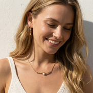 Elegant Pearl Gold Necklace Australia NZ - woman wearing One Line Pearl Gold Necklace with adjustable gold-tone chain and pearl detail