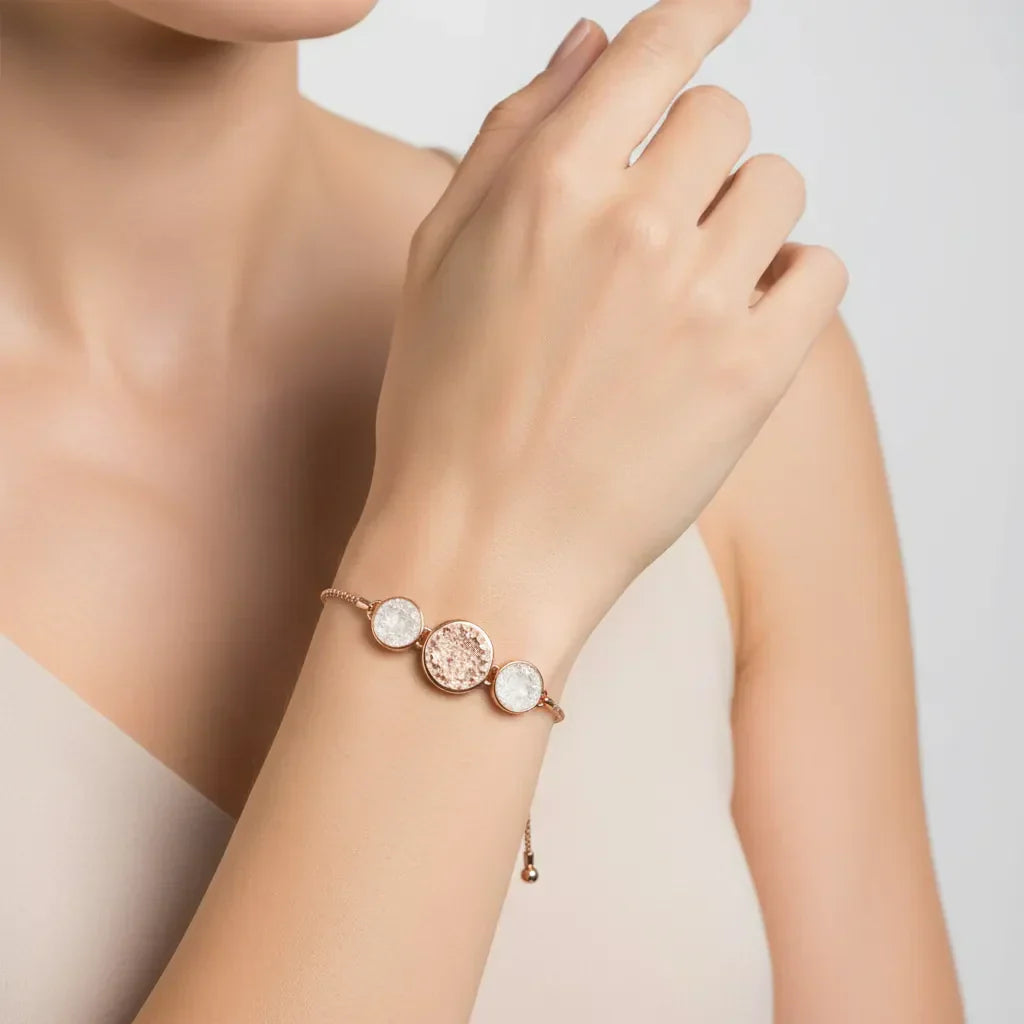 White Sandy Adjustable Bracelet with rose gold finish and dual circle accents on white background