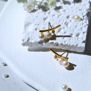 Nusa Crystal Pearl gold plated stud earrings with white crystals and pearls, 16mm by 7mm